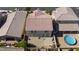 A private backyard featuring a cozy patio area, gravel area, above ground pool, and well-maintained landscaping at 210 Red Sandstone Ave, North Las Vegas, NV 89031