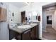 Bathroom features double sinks with granite countertops, offering a functional and stylish space at 210 Red Sandstone Ave, North Las Vegas, NV 89031