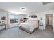 Comfortable bedroom featuring large window, plush carpet, and a desk area at 210 Red Sandstone Ave, North Las Vegas, NV 89031
