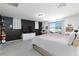 Bright bedroom featuring large window, plush carpet, and stylish black accent wall at 210 Red Sandstone Ave, North Las Vegas, NV 89031
