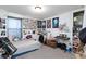 Eclectic bedroom with posters, a bed, a keyboard, and decorative items showcasing a personalized and creative space at 210 Red Sandstone Ave, North Las Vegas, NV 89031