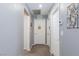 Neutral hallway with white doors, creating a clean and bright passageway within the home at 210 Red Sandstone Ave, North Las Vegas, NV 89031