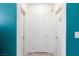 Hallway with neutral colors and three doors at 210 Red Sandstone Ave, North Las Vegas, NV 89031