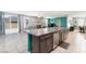Open concept kitchen, dining and living room with stainless steel appliances at 210 Red Sandstone Ave, North Las Vegas, NV 89031