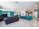 Bright, open-concept living room with modern decor and a large kitchen island at 210 Red Sandstone Ave, North Las Vegas, NV 89031