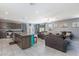 Open-concept living room featuring a large island, stainless appliances and comfortable seating at 210 Red Sandstone Ave, North Las Vegas, NV 89031