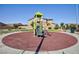 Community playground includes a play structure, benches, picnic tables, and surrounding green spaces at 210 Red Sandstone Ave, North Las Vegas, NV 89031