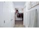 Bright walk-in closet with neat organization, racks of clothes, and natural light from a small window at 210 Red Sandstone Ave, North Las Vegas, NV 89031