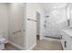 Beautiful bathroom with new flooring, dual sink, walk in shower, and modern fixtures at 2118 High Mesa Dr, Henderson, NV 89012