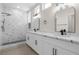 Modern bathroom with double sinks, a large walk-in shower, and stylish fixtures with a bright open concept at 2118 High Mesa Dr, Henderson, NV 89012