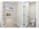 En suite bathroom with neutral paint, modern fixtures, and an adjacent living space at 2118 High Mesa Dr, Henderson, NV 89012