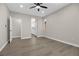 Spacious bedroom with neutral colors, ceiling fan, and wood-look flooring at 2118 High Mesa Dr, Henderson, NV 89012