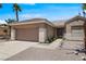 Well-maintained single-story home with a two-car garage, desert landscaping and a secure gated entry at 2118 High Mesa Dr, Henderson, NV 89012