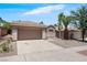 Lovely single-story home with a two-car garage, desert landscaping, and well manicured curb appeal at 2118 High Mesa Dr, Henderson, NV 89012