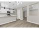 Open floor plan with kitchen island, stainless steel appliances, and modern lighting at 2118 High Mesa Dr, Henderson, NV 89012