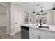 Open kitchen featuring an island with marble countertop and stainless steel appliances at 2118 High Mesa Dr, Henderson, NV 89012