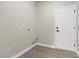 A clean laundry room with connections for a washer and dryer, and white paint at 2118 High Mesa Dr, Henderson, NV 89012