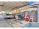 Covered patio is an outdoor utility space with grill, storage, and vintage car at 224 Catalini St, Las Vegas, NV 89107