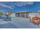 Home's pool and covered patio create an inviting space for outdoor living and relaxation at 224 Catalini St, Las Vegas, NV 89107