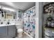 Bathroom with a vanity, toilet, and shower featuring a decorative butterfly shower curtain at 224 Catalini St, Las Vegas, NV 89107