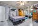 Bedroom with grey walls, tiled flooring, featuring a window and a large mirror at 224 Catalini St, Las Vegas, NV 89107