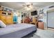 Bedroom with grey walls, tiled flooring, with mirror and a lot of decor at 224 Catalini St, Las Vegas, NV 89107