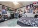 A bedroom with colorful decor and lots of personal items at 224 Catalini St, Las Vegas, NV 89107