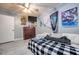Bedroom with gray walls, tiled flooring, featuring decor and a comfortable seating area at 224 Catalini St, Las Vegas, NV 89107