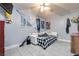 Cozy bedroom featuring a unique decor, tiled floors, and comfortable seating at 224 Catalini St, Las Vegas, NV 89107