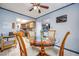Charming dining area adjacent to kitchen with glass table and four chairs at 224 Catalini St, Las Vegas, NV 89107