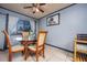 Cozy dining area with a round table, comfortable chairs, and natural light at 224 Catalini St, Las Vegas, NV 89107