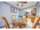 Open dining area with clear view into kitchen, featuring a wood-trimmed glass table at 224 Catalini St, Las Vegas, NV 89107