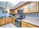Efficient kitchen with stainless steel range and microwave, offering ample counter space at 224 Catalini St, Las Vegas, NV 89107