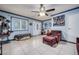 Bright living room with tiled floors, comfortable seating, ceiling fan and updated decor at 224 Catalini St, Las Vegas, NV 89107