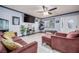 Inviting living room with plush seating, ceiling fan, and ample natural light at 224 Catalini St, Las Vegas, NV 89107