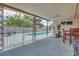 The large, covered patio overlooks the pool, and it includes dining and fitness equipment at 224 Catalini St, Las Vegas, NV 89107