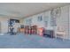 This covered patio includes fitness equipment, a dining area, and extra seating at 224 Catalini St, Las Vegas, NV 89107