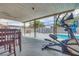 Covered patio offers outdoor dining and fitness area, overlooking a refreshing pool at 224 Catalini St, Las Vegas, NV 89107