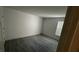 Empty room with gray vinyl floors and freshly painted white walls at 2606 S Durango Dr # 142, Las Vegas, NV 89117