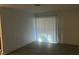 Empty room with gray vinyl floors and freshly painted white walls at 2606 S Durango Dr # 142, Las Vegas, NV 89117