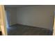 Empty room with gray vinyl floors and freshly painted white walls at 2606 S Durango Dr # 142, Las Vegas, NV 89117