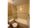 Small bathroom with beige tile surround, a shower-tub combo, and light fixtures for a bright and functional space at 2655 Aracatuba Ave, Las Vegas, NV 89121
