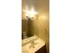 Bathroom with a standard mirror, lighting, towel rack and sink at 2655 Aracatuba Ave, Las Vegas, NV 89121