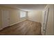 Bright bedroom with wood floors features a window and neutral paint at 2655 Aracatuba Ave, Las Vegas, NV 89121