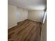 Cozy bedroom featuring beautiful hardwood floors, neutral paint, and natural light at 2655 Aracatuba Ave, Las Vegas, NV 89121