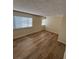 Bedroom features wood floors, a window, and neutral walls at 2655 Aracatuba Ave, Las Vegas, NV 89121