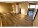 Bedroom with wood floors features neutral walls and multiple doorways at 2655 Aracatuba Ave, Las Vegas, NV 89121