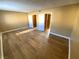 Spacious bedroom with hardwood flooring, featuring neutral wall paint and closet space at 2655 Aracatuba Ave, Las Vegas, NV 89121