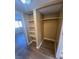 Organized closet with shelving, offering ample storage space and organization for clothing and items at 2655 Aracatuba Ave, Las Vegas, NV 89121