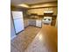 Functional kitchen with white appliances and tile flooring at 2655 Aracatuba Ave, Las Vegas, NV 89121